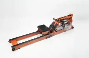 a wooden exercise machine with a clear round object